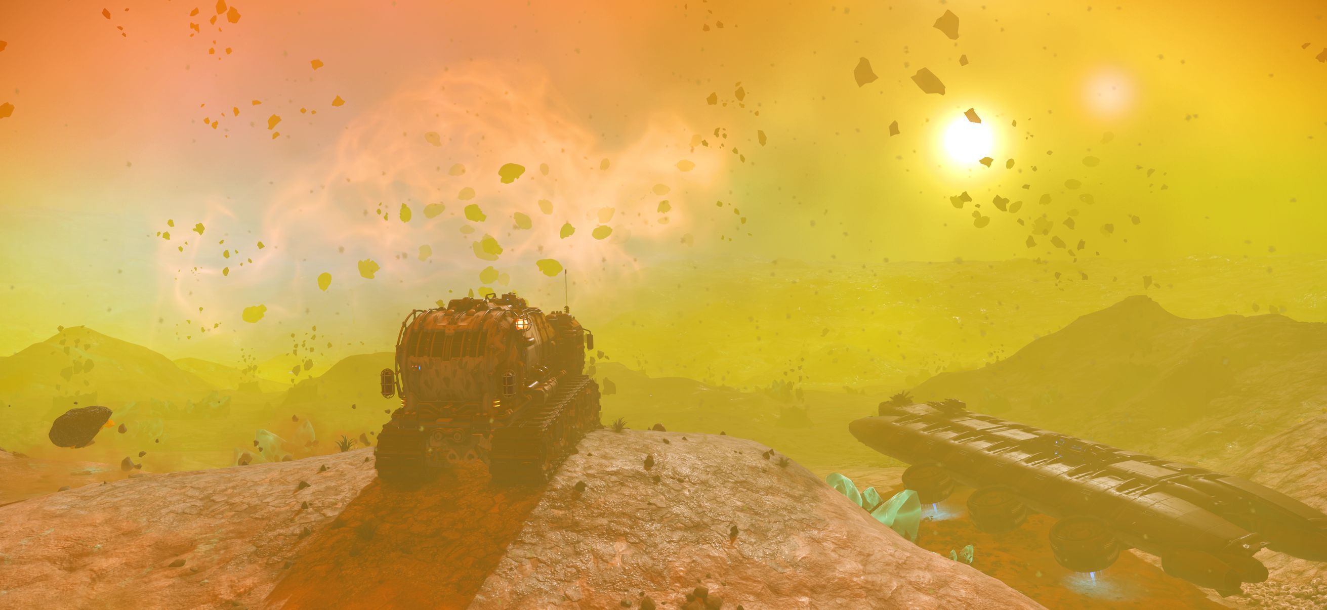 A tracked exocraft parked on a rocky ridge under a hazy orange and yellow sky full of floating rocks, with a long starship resting on the ground beside it